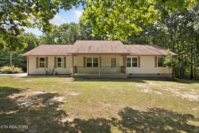 ranch-style home with a front lawn