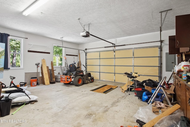 garage featuring electric panel and a garage door opener