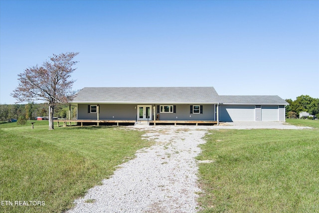 view of front of house featuring a garage and a front yard