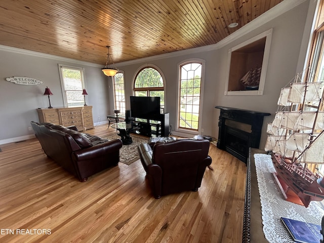 living area with a fireplace, light wood-style floors, ornamental molding, wood ceiling, and baseboards