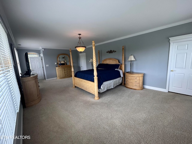 carpeted bedroom featuring ornamental molding