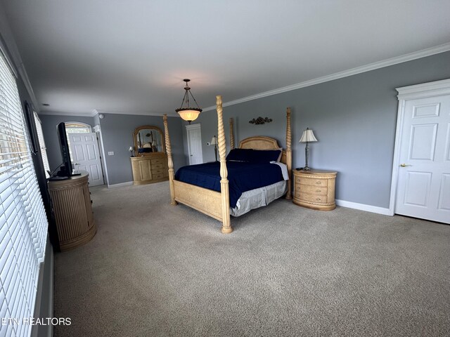 carpeted bedroom with baseboards, arched walkways, and crown molding