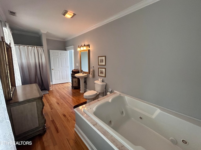 full bathroom with toilet, ornamental molding, independent shower and bath, sink, and hardwood / wood-style flooring