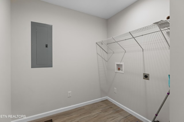 laundry room with laundry area, electric panel, baseboards, hookup for an electric dryer, and washer hookup