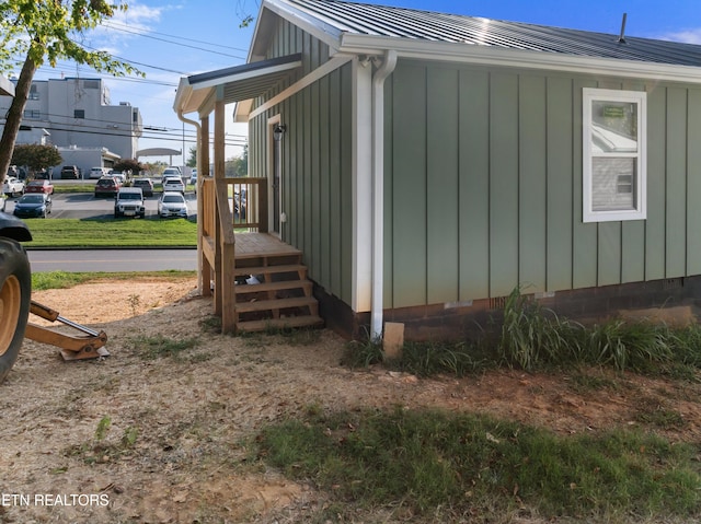 view of home's exterior featuring metal roof and board and batten siding