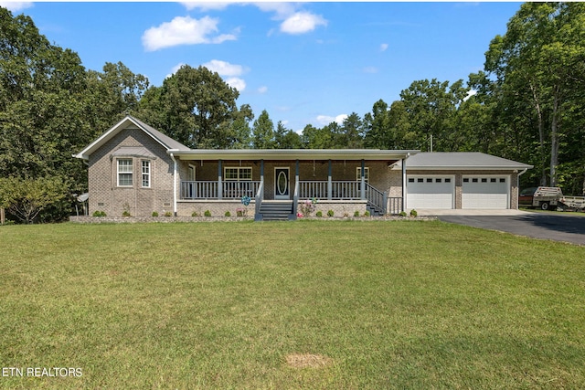 ranch-style house with a front lawn, a garage, and covered porch