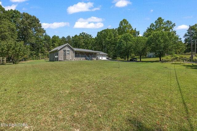 view of yard featuring covered porch