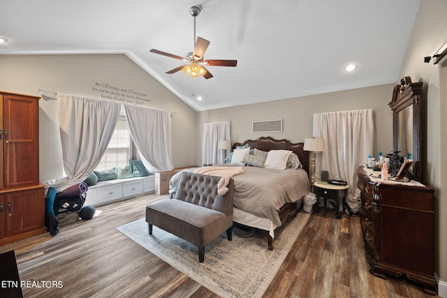 bedroom with lofted ceiling, hardwood / wood-style floors, and ceiling fan