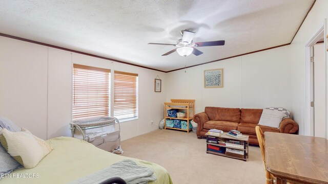 carpeted bedroom featuring a textured ceiling and ceiling fan