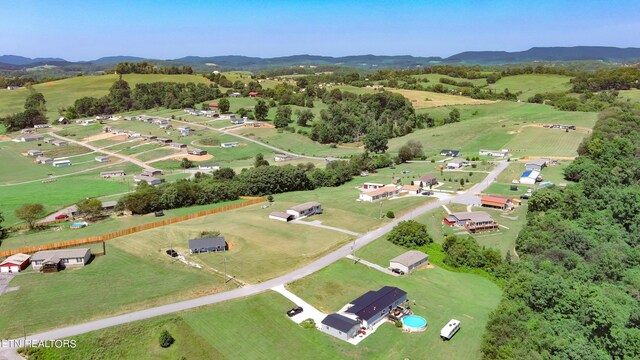 drone / aerial view featuring a mountain view