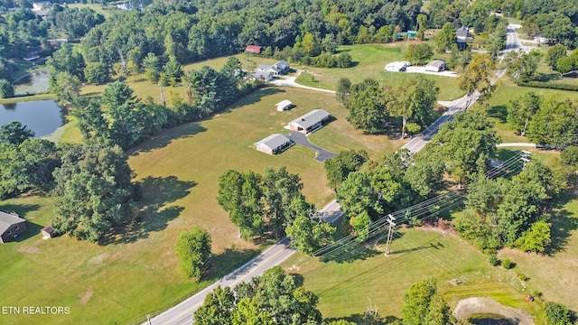 aerial view with a rural view and a water view