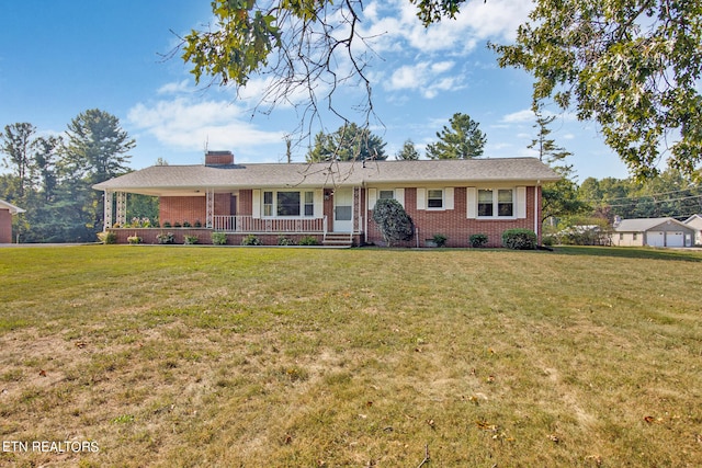 single story home featuring covered porch and a front lawn