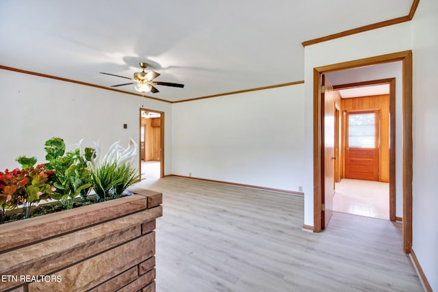 unfurnished room featuring light hardwood / wood-style flooring, ceiling fan, and ornamental molding