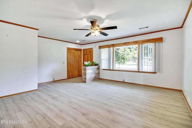 unfurnished room featuring ceiling fan, crown molding, and light hardwood / wood-style flooring