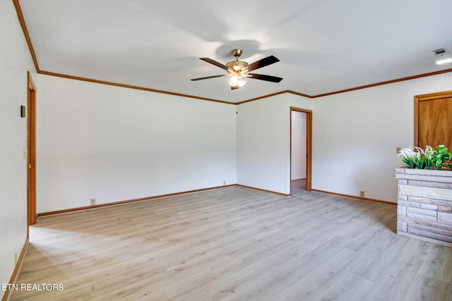 empty room featuring ornamental molding, light hardwood / wood-style flooring, and ceiling fan