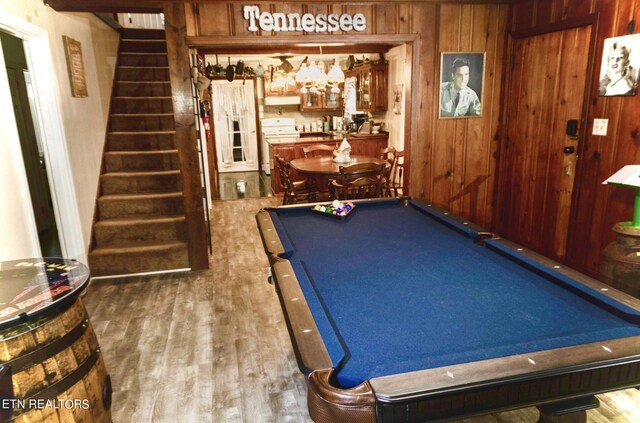 recreation room with wood walls, pool table, indoor bar, and wood-type flooring