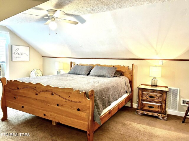 carpeted bedroom featuring lofted ceiling, ceiling fan, and a textured ceiling