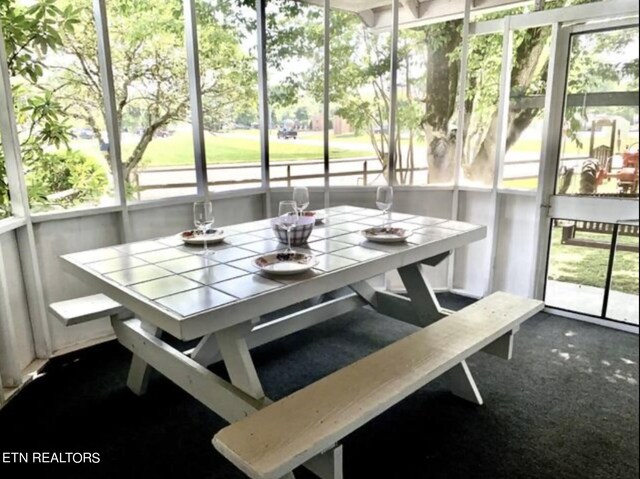 sunroom / solarium with plenty of natural light