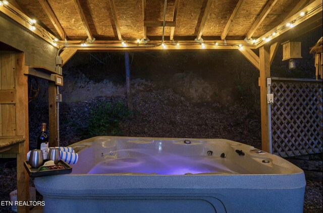 interior space featuring lofted ceiling and a jacuzzi