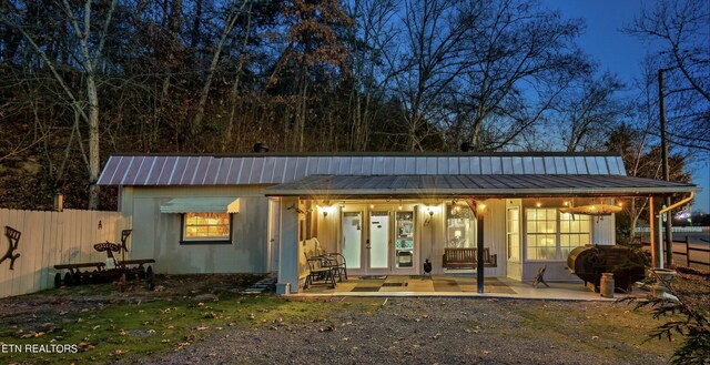 back of property featuring a porch