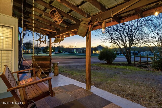 view of patio terrace at dusk