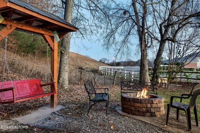 exterior space with an outdoor fire pit