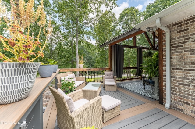 wooden terrace featuring an outdoor hangout area