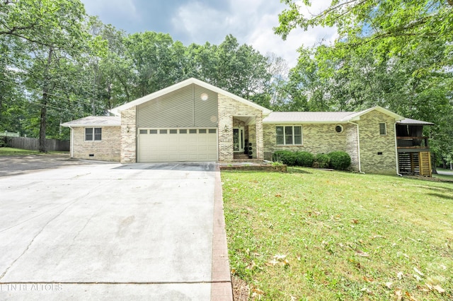 ranch-style home with a garage and a front lawn