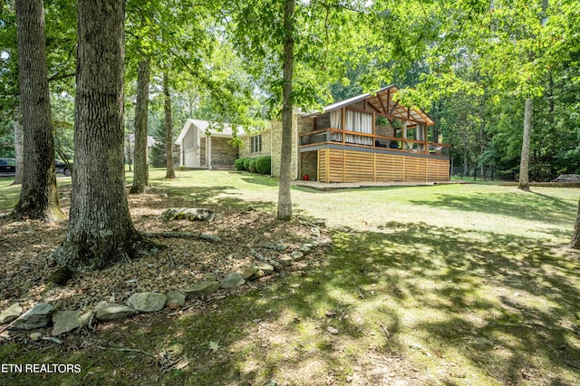 view of yard featuring a deck