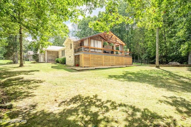 view of yard with a wooden deck