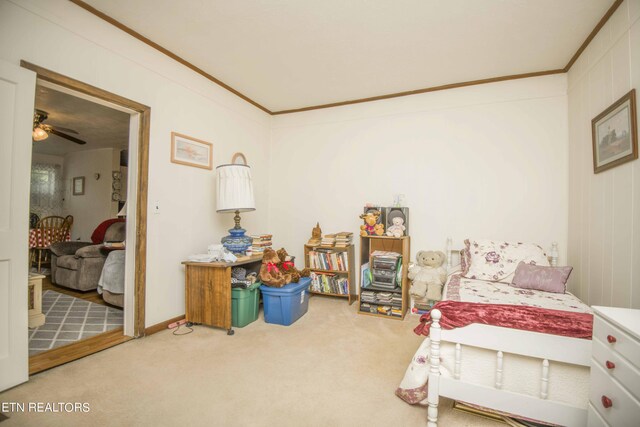 carpeted bedroom featuring crown molding