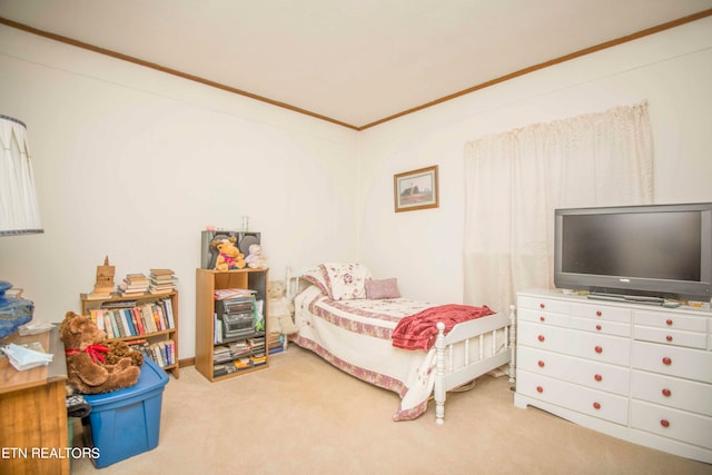 bedroom with crown molding and light carpet