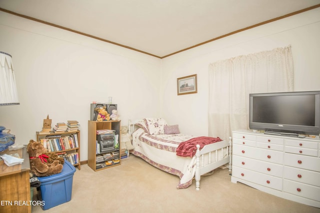 carpeted bedroom featuring crown molding