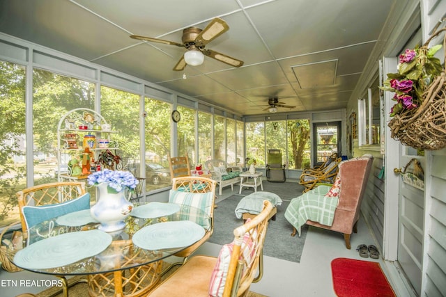 sunroom with a ceiling fan