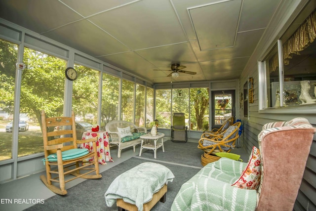 sunroom with a ceiling fan