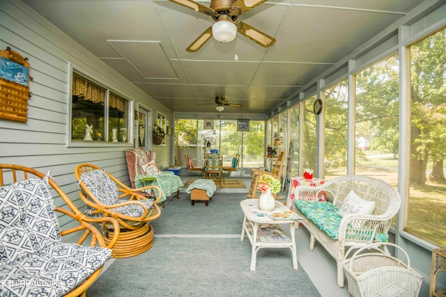 sunroom with ceiling fan and a healthy amount of sunlight