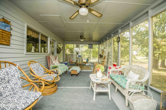 sunroom featuring a ceiling fan