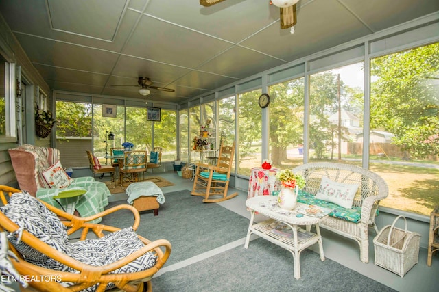 sunroom featuring ceiling fan