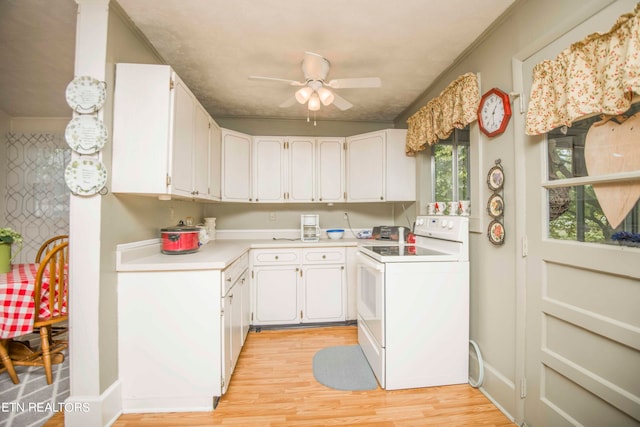 kitchen featuring ceiling fan, electric stove, white cabinets, and light hardwood / wood-style floors