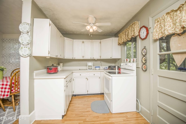 kitchen with light wood finished floors, light countertops, electric range, a ceiling fan, and white cabinets