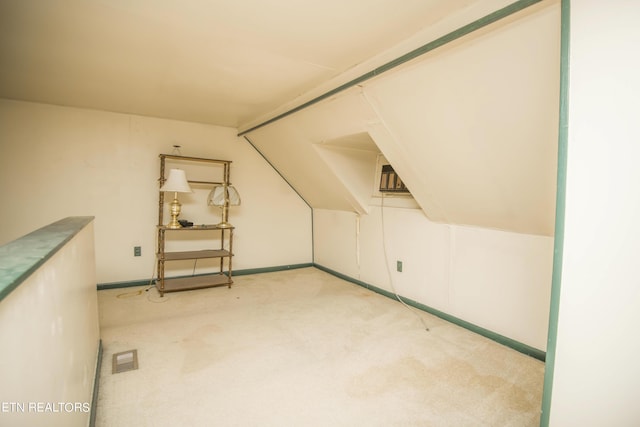 bonus room featuring baseboards, visible vents, and carpet flooring