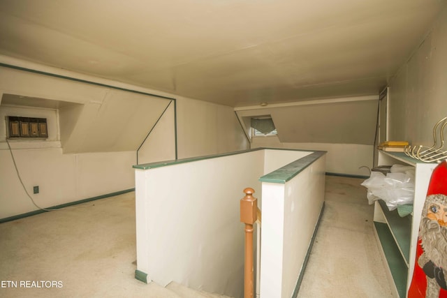 interior space featuring light carpet and a wall unit AC