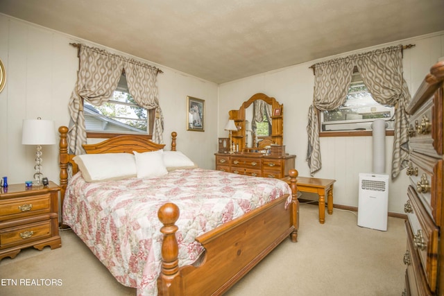 bedroom featuring light carpet