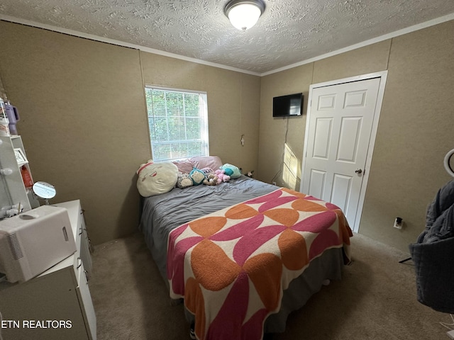 carpeted bedroom with crown molding and a textured ceiling