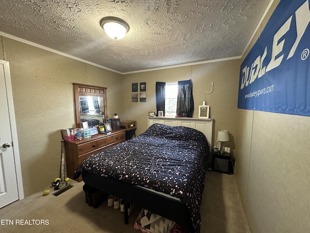 bedroom with a textured ceiling, ornamental molding, and carpet flooring