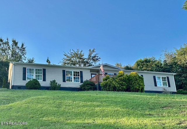 manufactured / mobile home with a front lawn and crawl space