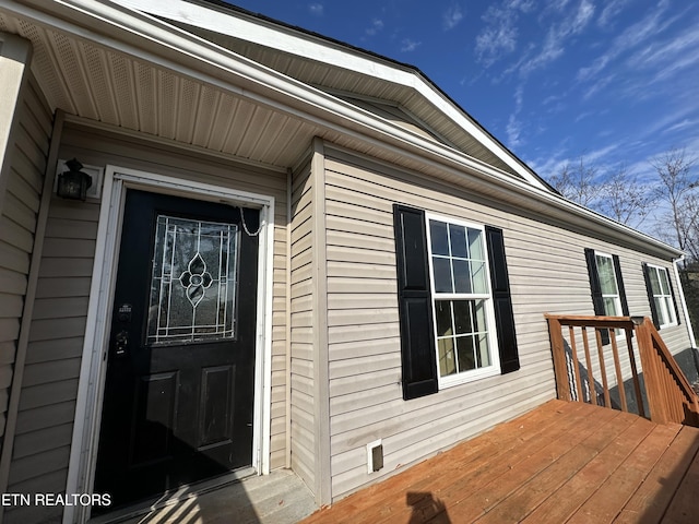 property entrance with a deck