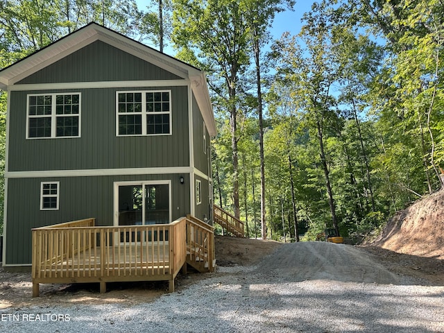 back of house featuring a deck