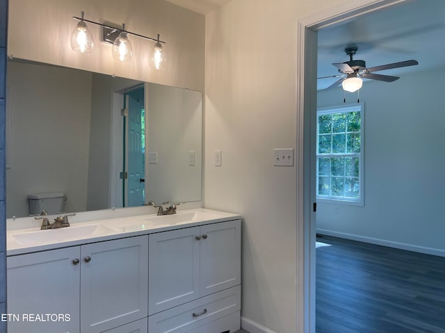 bathroom featuring hardwood / wood-style floors, ceiling fan, toilet, and vanity