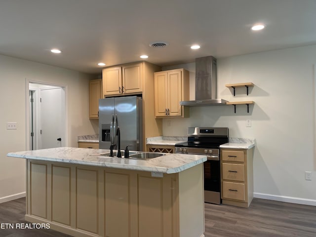 kitchen featuring wall chimney range hood, sink, dark hardwood / wood-style floors, an island with sink, and appliances with stainless steel finishes